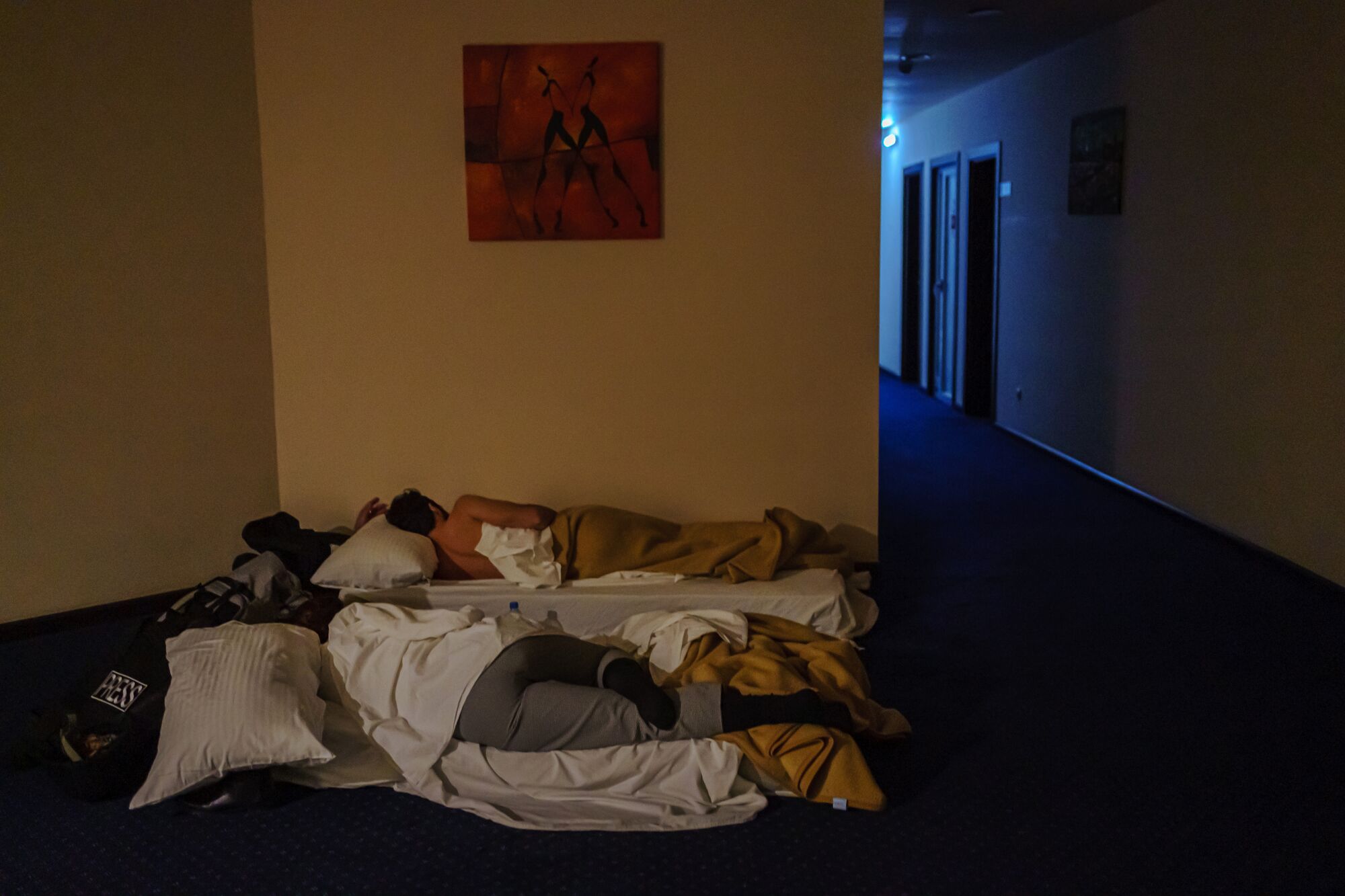 Guests at a hotel in Stepanakert, Nagorno-Karabakh, sleep in a hallway to avoid shrapnel and debris.