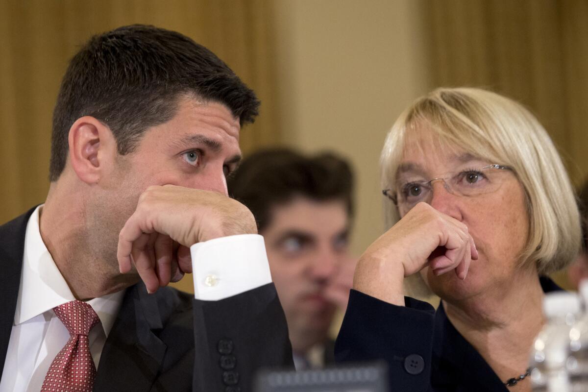 House Budget Committee Chairman Rep. Paul Ryan (R-Wis.), left, speaking with Senate Budget Committee Chair Sen. Patty Murray, (D-Wash.) on Capitol Hill in Washington at the start of a Congressional Budget Conference.