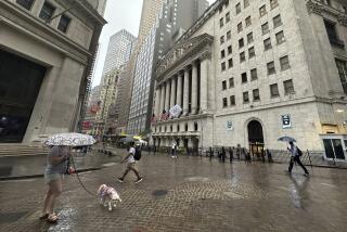 FILE - People walk past the New York Stock Exchange on Aug. 7, 2024 in New York. (AP Photo/Peter Morgan, File)