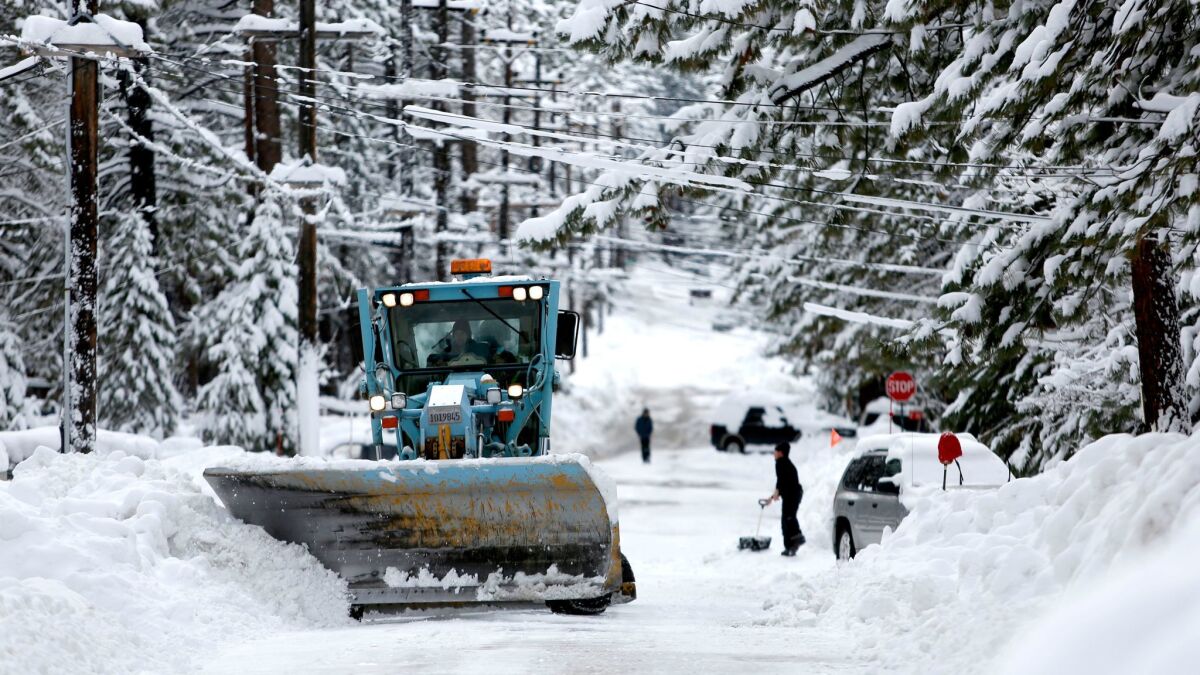 A plow removes snow along Aspen Ave., in South Lake Tahoe in January.