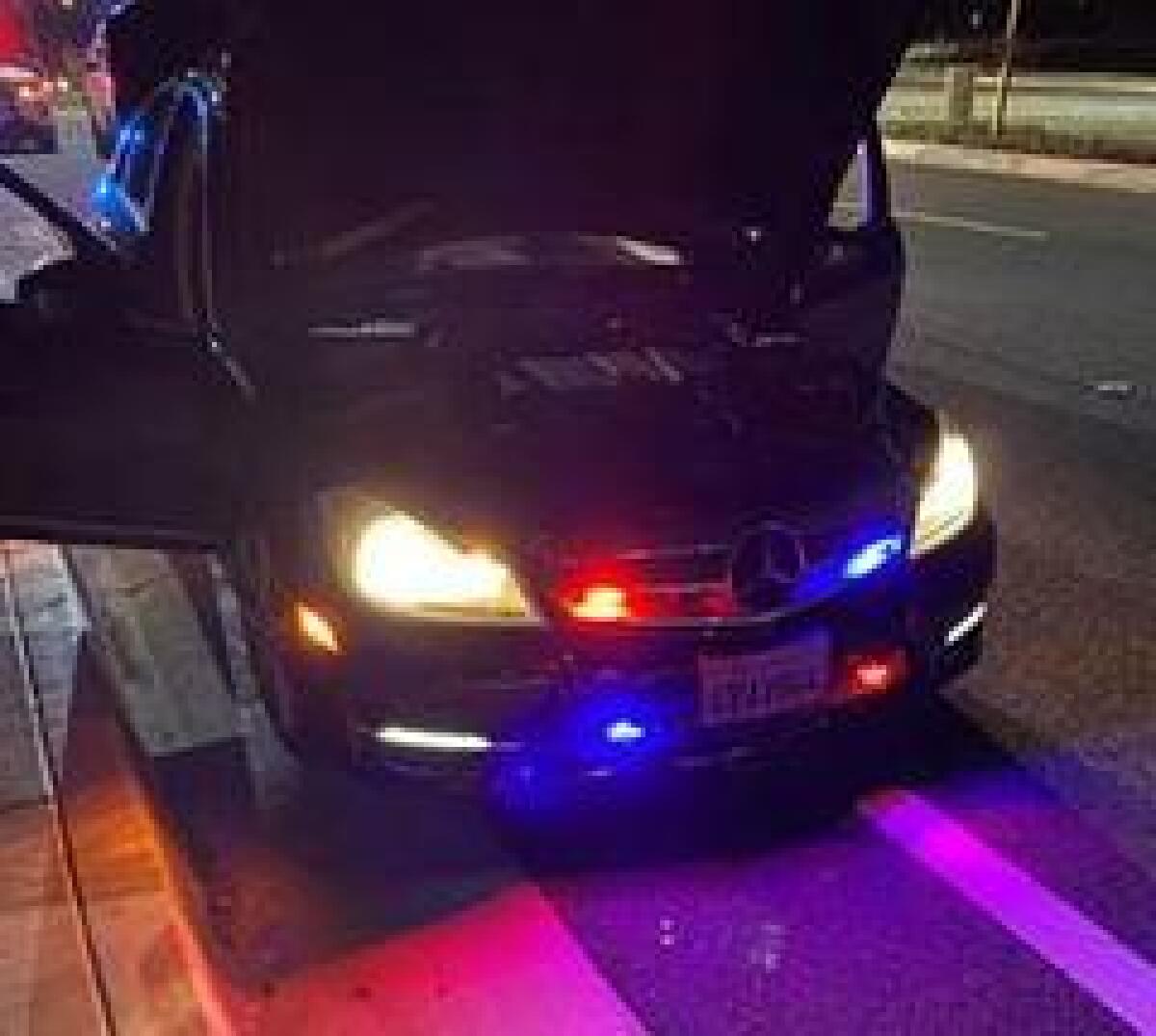 Franklin Lopez Alas, 23, was arrested Tuesday on suspicion of impersonating a police officer after authorities say he passed a detective on the freeway while flashing red-and-blue lights on his Mercedes-Benz.
