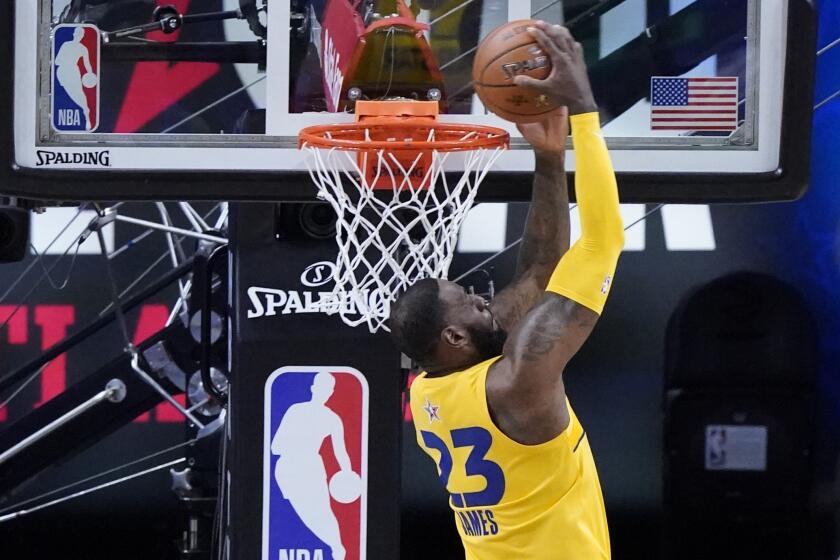 Lakers forward LeBron James dunks during the first half of the NBA All-Star Game in Atlanta on Sunday, March 7, 2021.