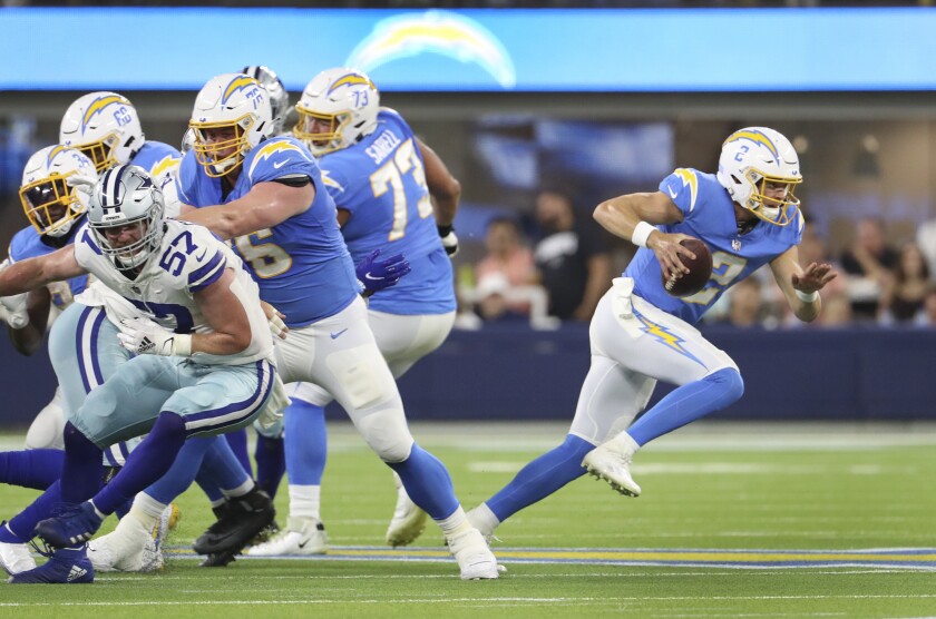 Easton Stick rushes the ball for the Chargers.