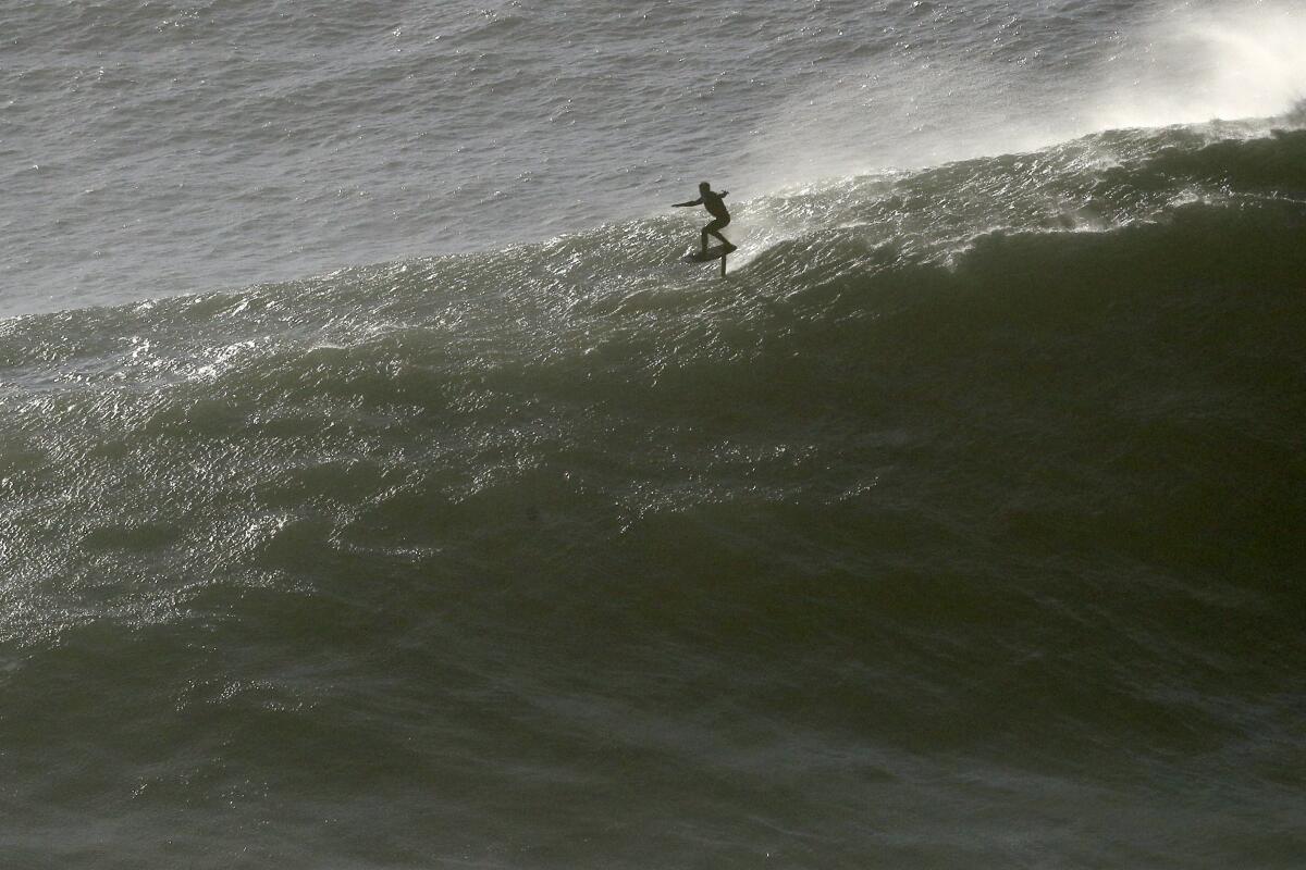 A surfer rides an hydrofoil  