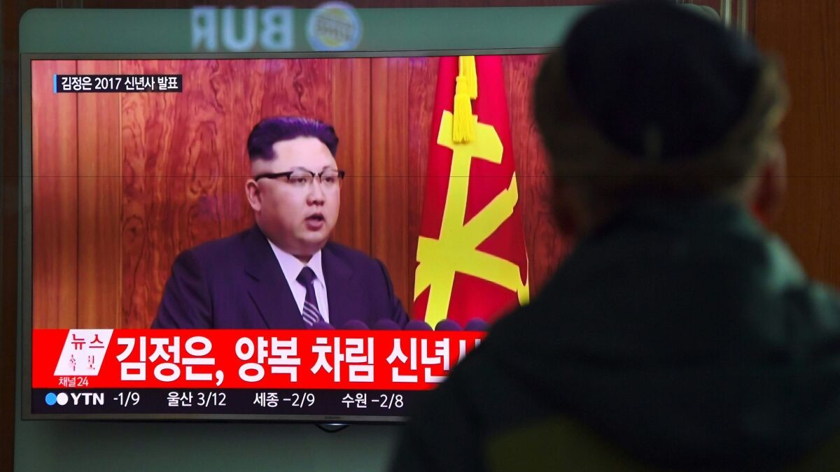 A man watches a television news broadcast on Dec. 31, 2016, at a railway station in Seoul showing North Korean leader Kim Jong Un's New Year's speech.