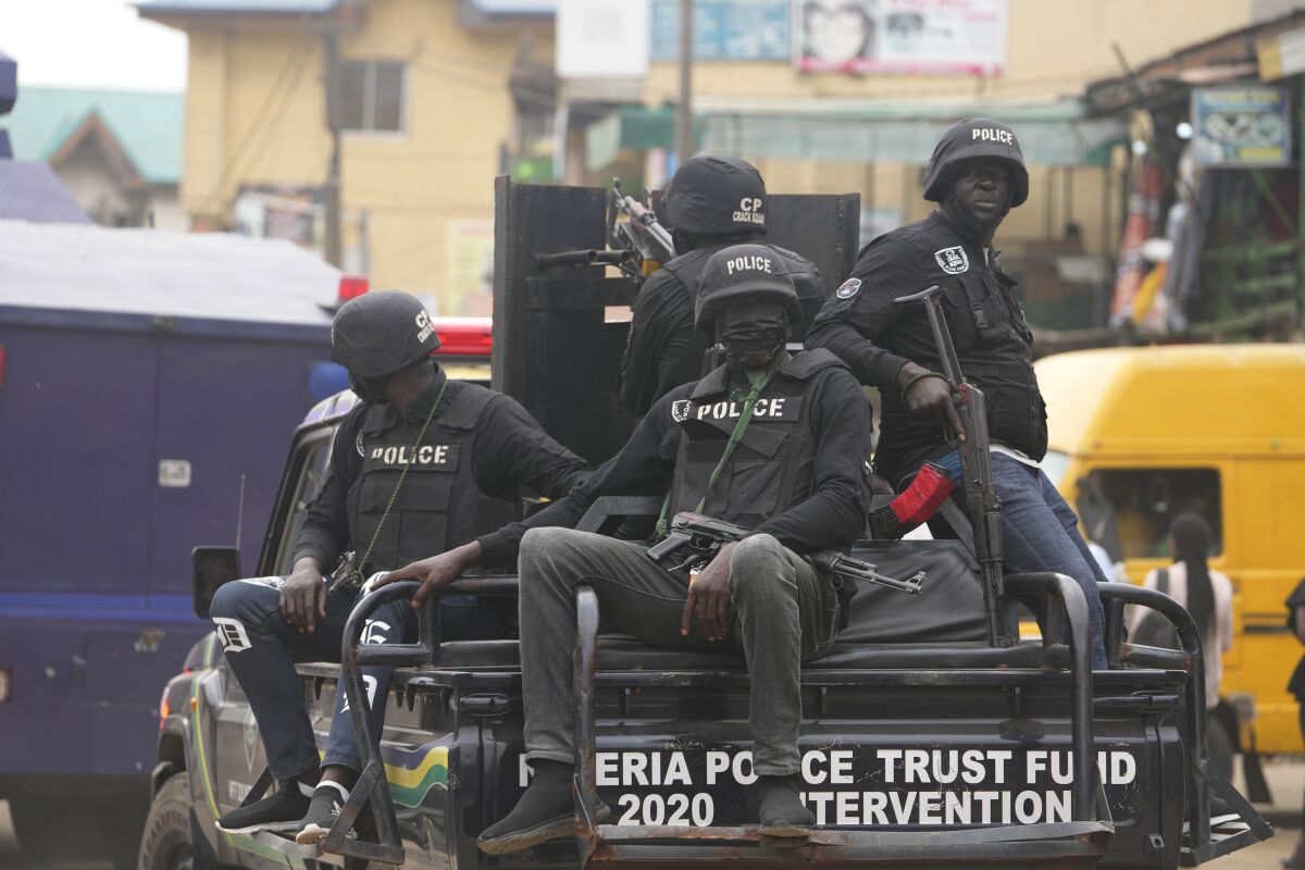 FILE- Police officers patrol during a protest by Nigeria Labour Congress on the street in Lagos, Nigeria, on July 26, 2022. Nigeria's police chief says hundreds of thousands of security forces are being deployed to ramp up safety in various troubled regions ahead of the country's Feb. 25 presidential election. More than 400,000 security personnel would be deployed for the vote in anticipation of challenges ranging from continued attacks by armed groups and suspected separatists targeting remote communities and the election commission's facilities to political thuggery and violent protests, Usman Baba, Nigeria's Inspector-General of Police, told reporters in the capital city of Abuja on Thursday. Feb. 16, 2023. (AP Photo/Sunday Alamba, File)