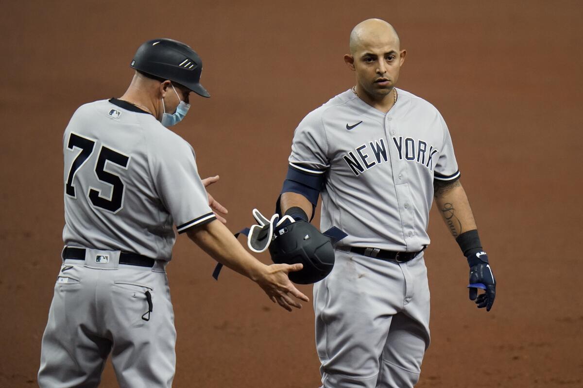 Odor snaps late tie with 1st hit as Yankee, NY tops Rays 8-4