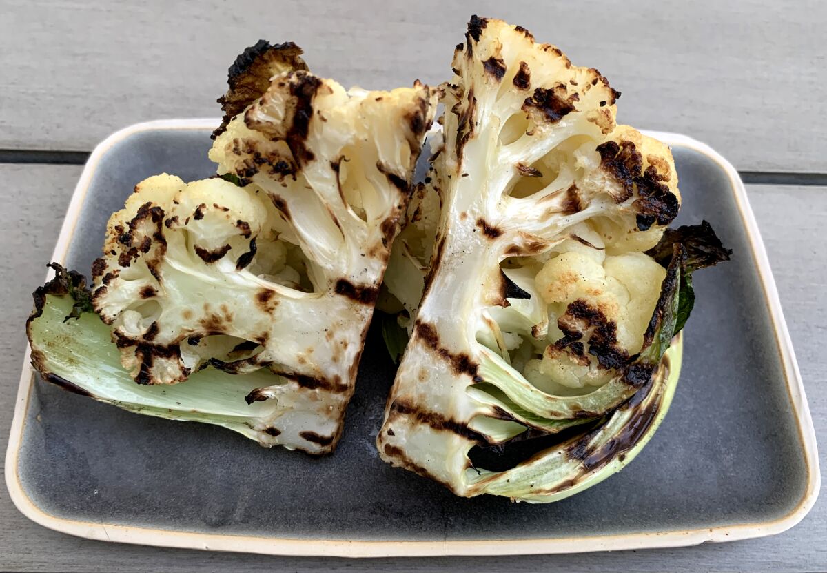 Olive oil, salt and pepper give grilled cauliflower a rich, savory taste that pairs with anything else you're serving.