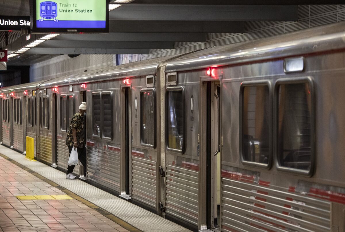 A man enters a Metro Red Line train at the North Hollywood station on May 20.