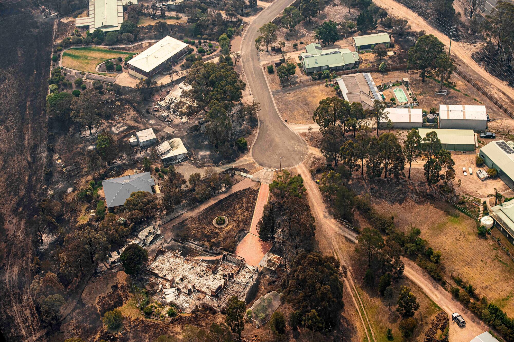 Property damaged by wildfires in Sarsfield, Australia. 