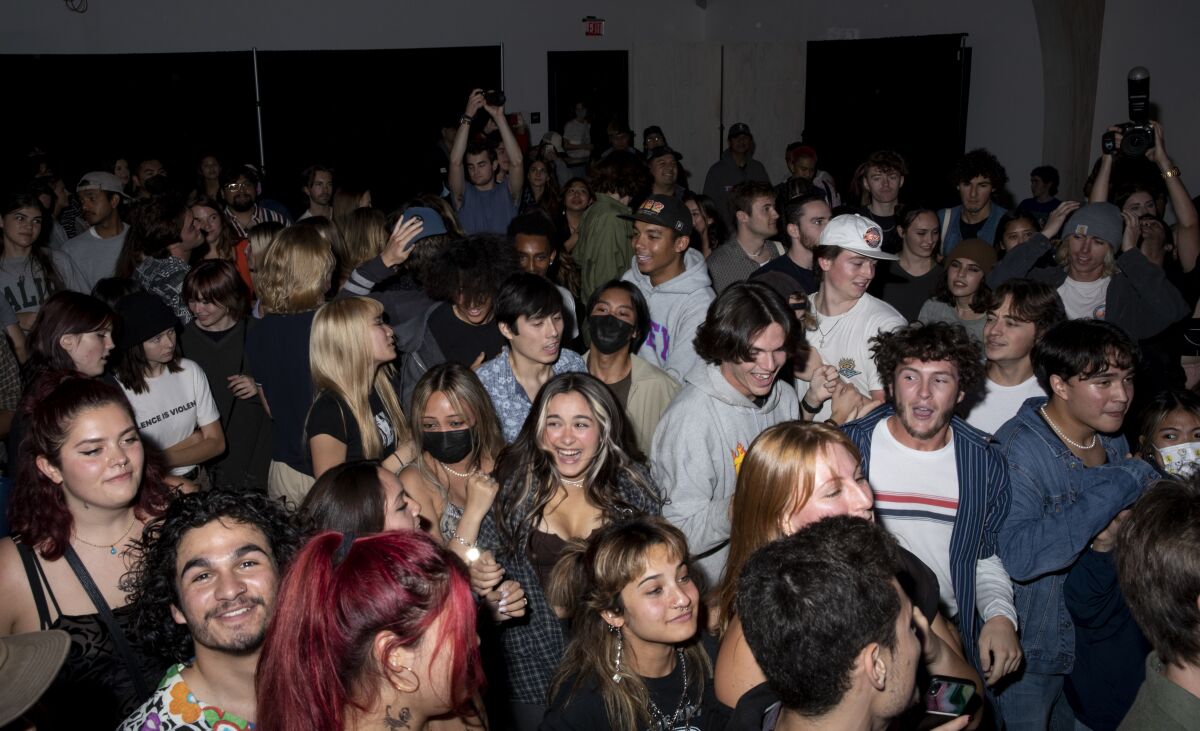 San Diego, California - November 05: Fans mosh during a show in a new music venue called Bridges.