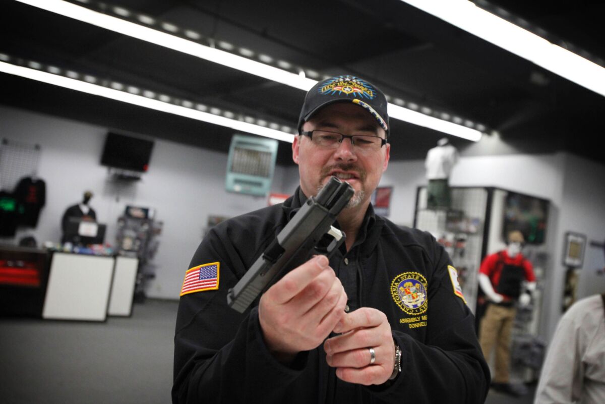 Assemblyman Tim Donnelly, a Republican candidate for governor, used borrowed firearms, including the handgun pictured here, at a gun range last week in Watsonville. His probation agreement prevents him from using weapons that are not registered to him.
