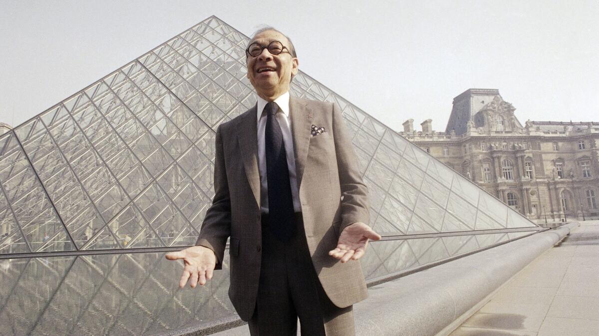 I.M. Pei in front of the Louvre glass pyramid, which he designed. The architect died this week at 102.