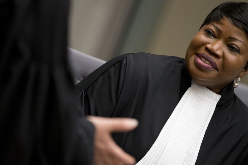 -FILE- In this Wednesday, April 4, 2018 image, chief prosecutor Fatou Bensouda waits for alleged jihadist leader Al Hassan Ag Abdoul Aziz Ag Mohamed Ag Mahmoud to enter the court room at the International Criminal Court in The Hague, Netherlands. The prosecutor of the International Criminal Court says she has had her U.S. visa revoked, in the first implementation of an American crackdown on the global tribunal.(AP Photo/Peter Dejong, Pool)