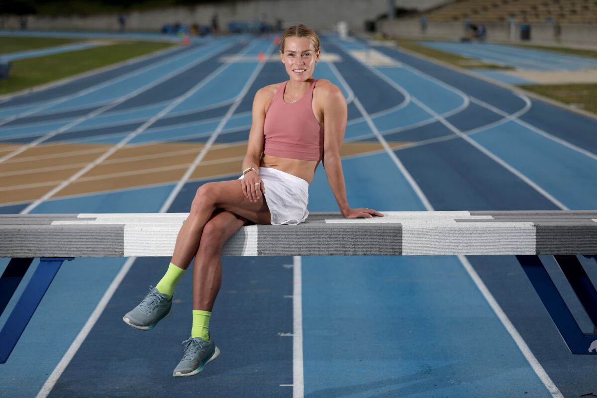 Colleen Quigley poses for a photo on the track at Drake Stadium on the UCLA campus.