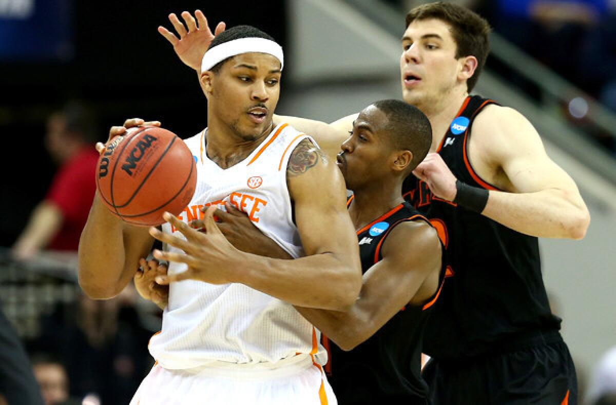 Anthony White Jr. (center), Daniel Coursey (right) and Mercer had a tough time slowing down Tennessee guard Jarnell Stokes on Sunday, when he had 17 points and 18 rebounds.