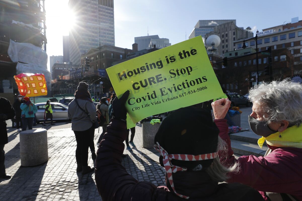 FILE - In this Jan. 13, 2021, file photo, tenants rights advocates demonstrate outside the Edward W. Brooke Courthouse in Boston. The Biden administration is taking steps to prevent evictions from public housing for nonpayment of rent, as it seeks to shore up protections following the end of the national eviction moratorium. (AP Photo/Michael Dwyer, file)