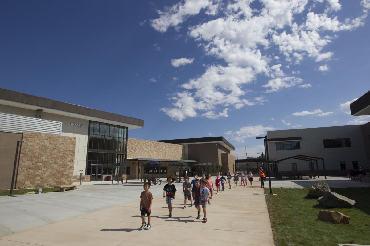 Students walk on campus at San Marcos Unified School District's Double Peak K8 school is the district's only K-8 facility. 