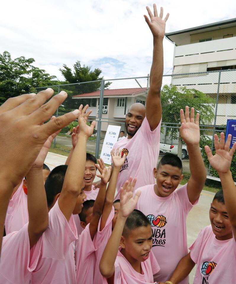NBA player Taj Gibson training with Thai youth boys