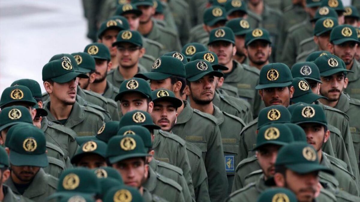 Islamic Revolutionary Guard troops arrive for a ceremony celebrating the 40th anniversary of Iran's Islamic Revolution in Tehran in February. Iran has been under U.S. sanctions for most of those 40 years.