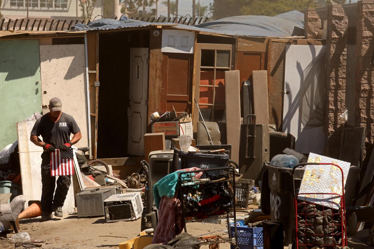 A firefighter in an encampment