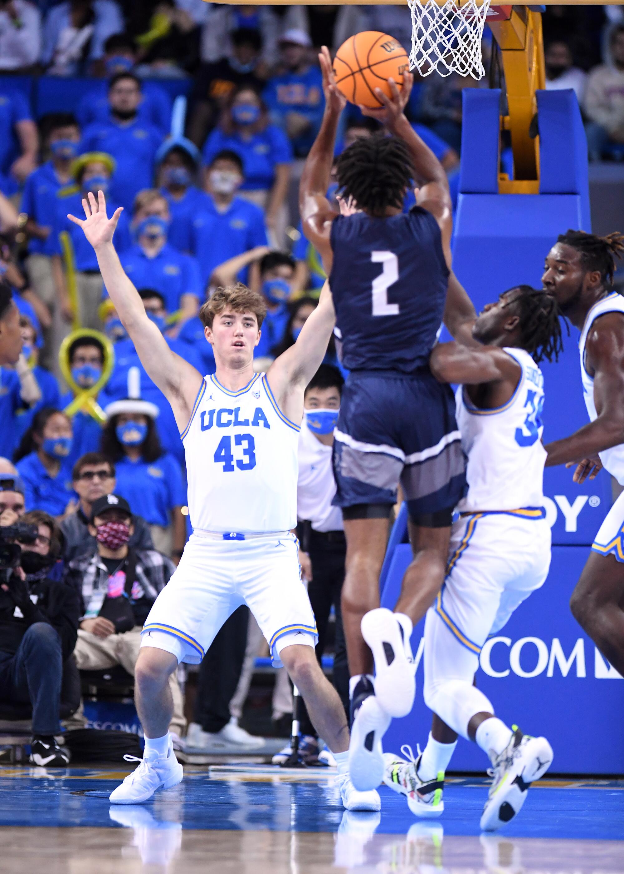 UCLA's Russell Stong contests a drive during a game against Northern Florida at Pauley Pavilion 