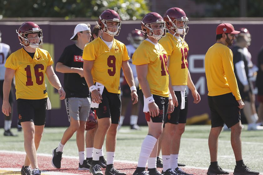 LOS ANGELES, CALIF. - AUG. 2, 2019. Quarterback JT Daniels (18) reports to the opening of training camp at USC on Friday, Aug. 2, 2019. A product of Santa Ana Mater Dei High School, Daniels started for the Trojans last season. With Daniels are teammates Scott Harris (16), Kedon Slovis (9) and Matt Fink (19). (Luis Sinco/Los Angeles Times)