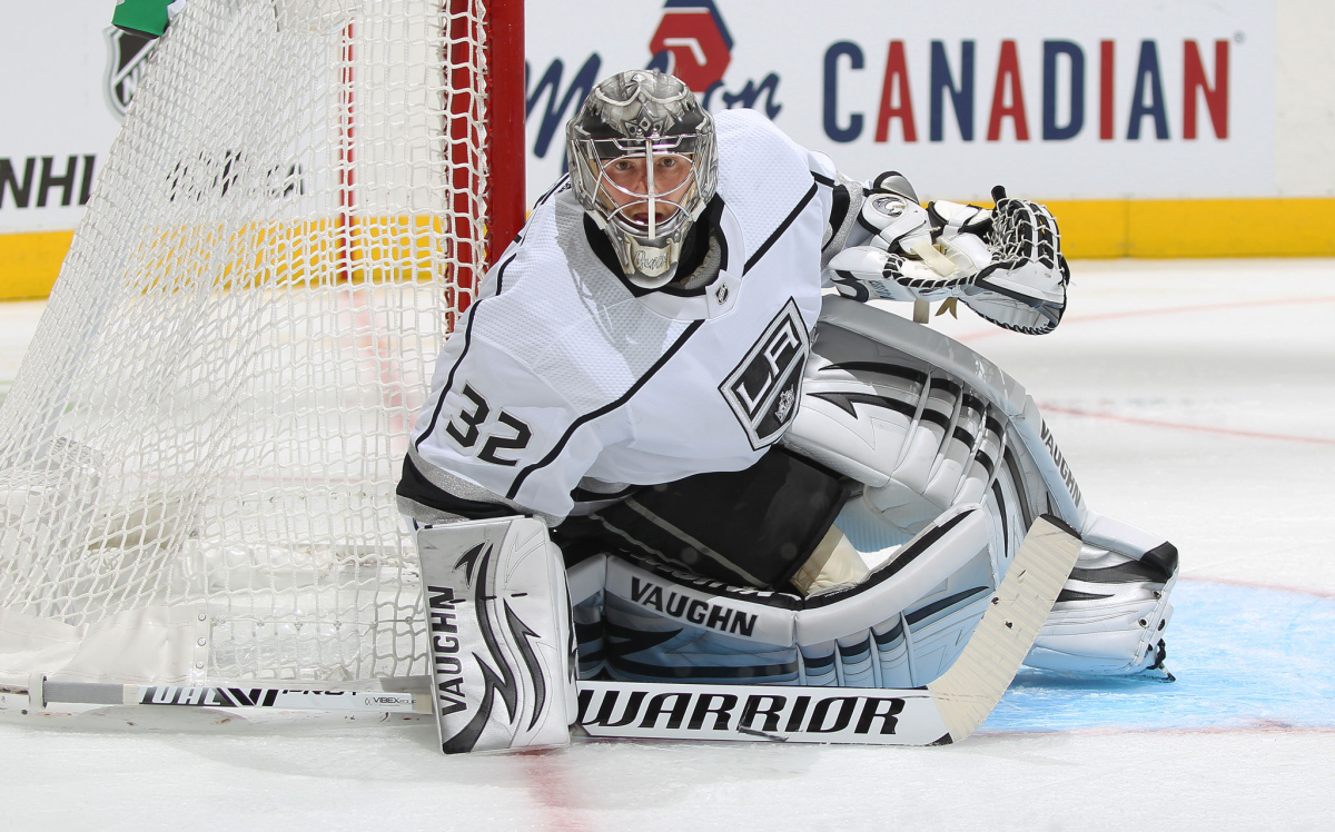 Kings goalkeeper Jonathan Quick  crouches in front of the net 