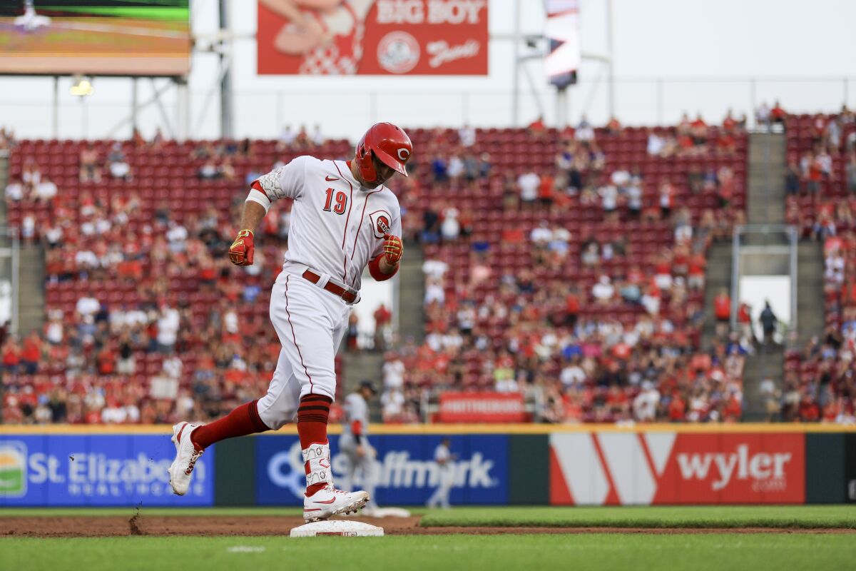 Cincinnati Reds' Joey Votto runs the bases after hitting a solo home run against the St. Louis Cardinals during the third inning of a baseball game in Cincinnati, Friday, July 22, 2022. (AP Photo/Aaron Doster)