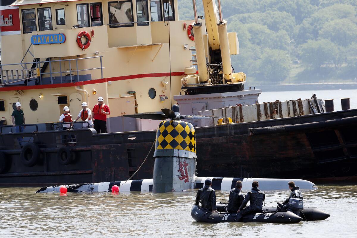 Officials remove a plane out of the Hudson River a day after it crashed on Saturday, May 28 in North Bergen, N.J.
