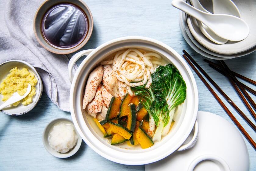 This one-pot soup combines chicken with noodles and winter squash. Prop styling by Kate Parisian.