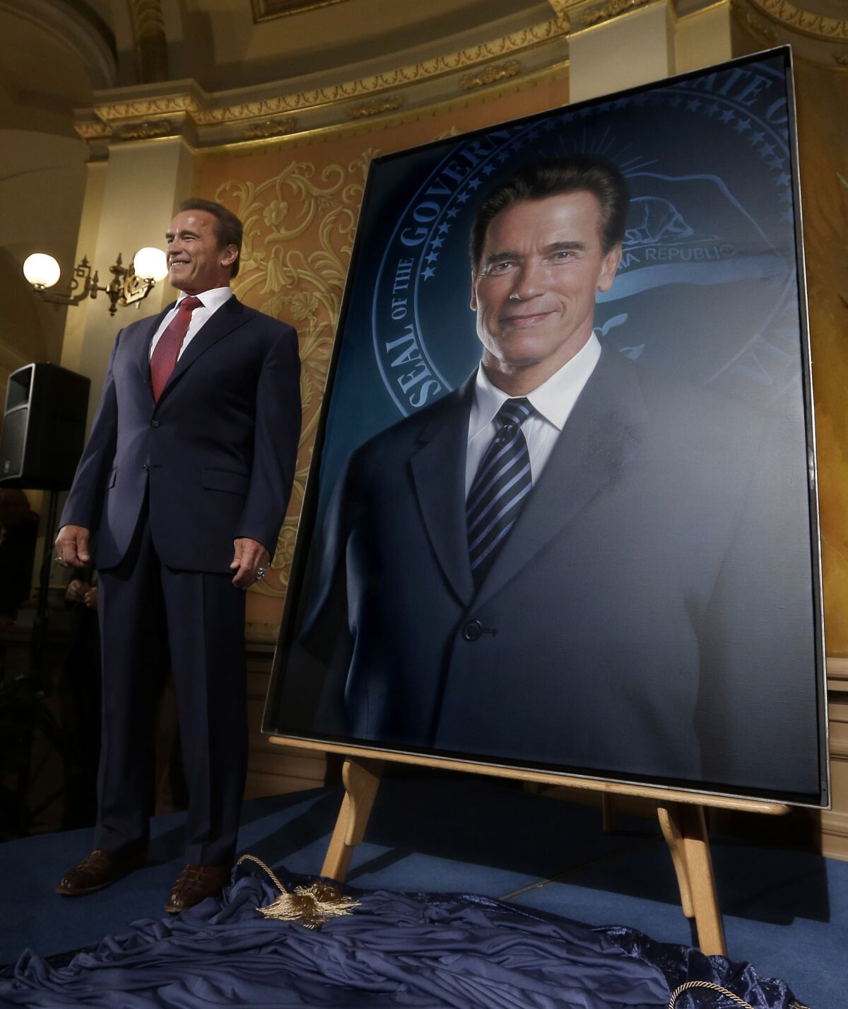 Former California Gov. Arnold Schwarzenegger's official portrait has been unveiled at the Capitol -- minus his ex-wife's face.