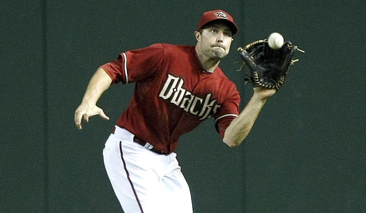 Diamondbacks center fielder A.J. Pollock makes a running catch against the San Diego Padres in the sixth inning of a game Wednesday in Phoenix.