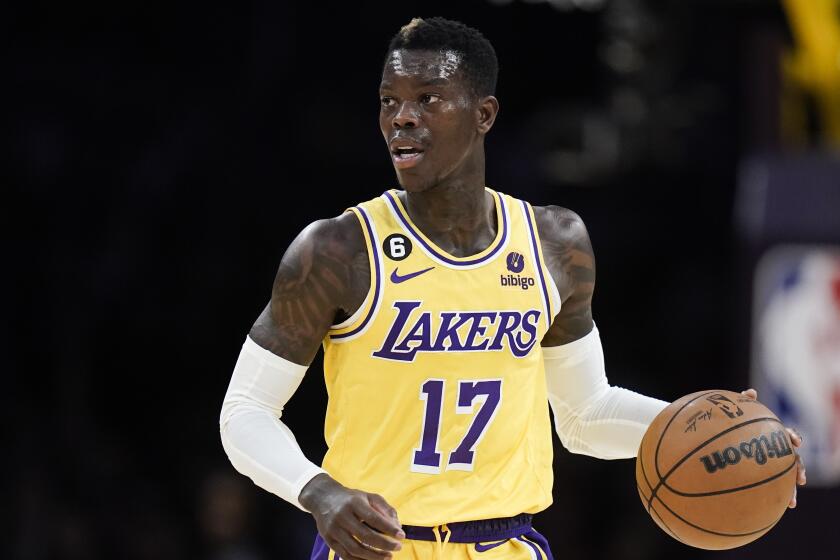 Los Angeles Lakers' Dennis Schroder dribbles the ball 