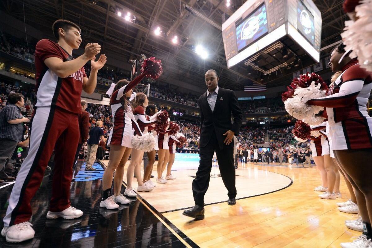 Harvard Coach Tommy Amaker walks off the court after losing to the Arizona Wildcats, 74-51, in the third round of the NCAA Tournament.