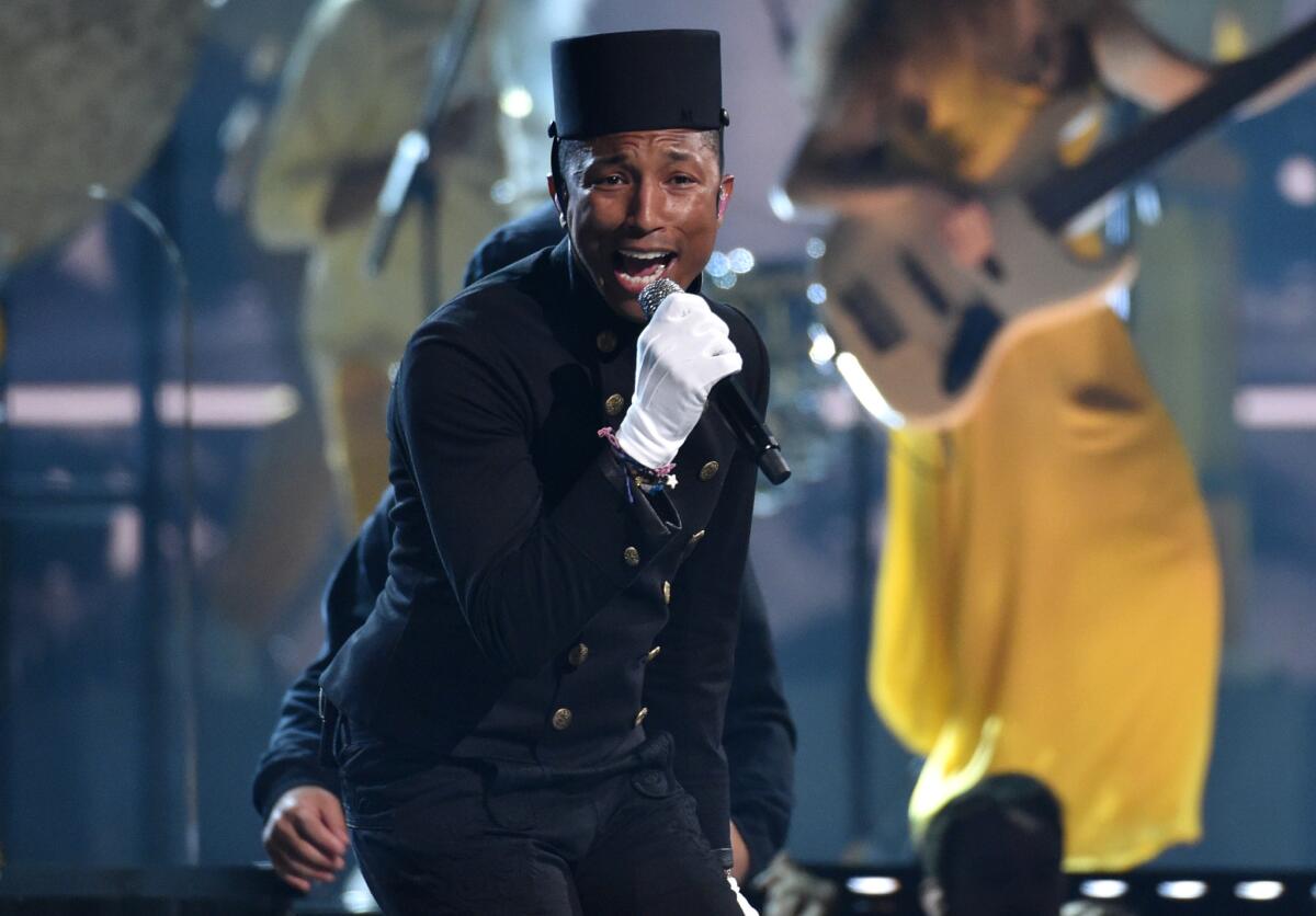 Pharrell Williams performs at the 2015 Grammy Awards in Los Angeles. The Council of Fashion Designers of America has announced that Williams will be honored with its 2015 Fashion Icon Award.