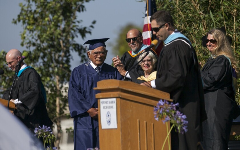 Don Miyada, a former Newport Harbor High student who couldn't graduate with his class in 1942 because he was sent to an internment camp, receives his diploma during Newport Harbor's 2014 commencement last week.