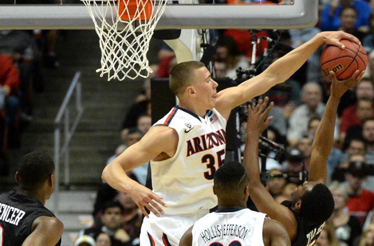 Arizona center Kaleb Tarczewski, a 7-foot sophomore, blocks a shot by San Diego State guard Xavier Thomas in the West Regional semifinal on Thursday.