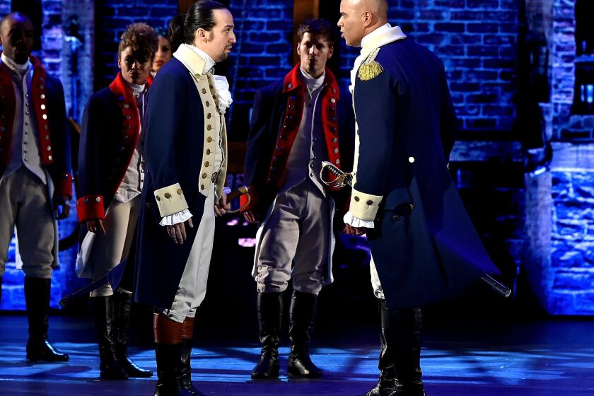 Christopher Jackson as George Washington, right, and Lin-Manuel Miranda as Alexander Hamilton face off to sing "Yorktown (The World Turned Upside Down)" at the Tony Awards.