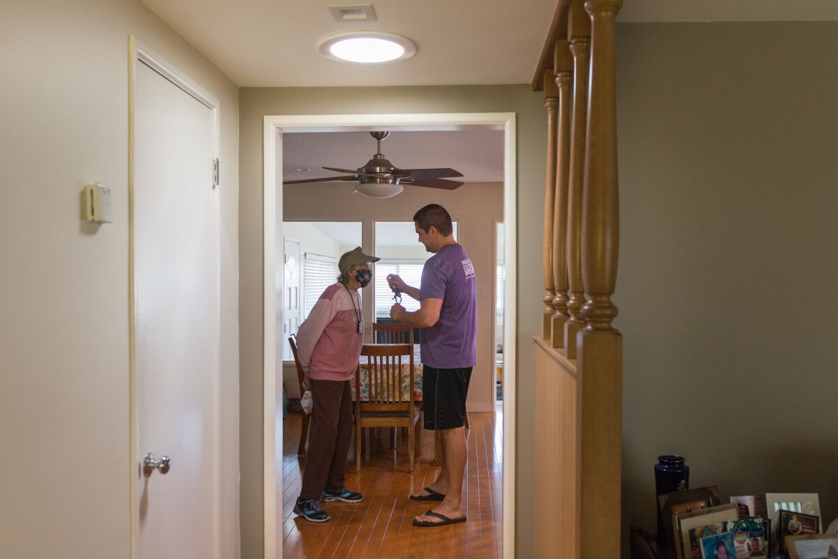 Daisey Conant and grandson Erik Hayhurst get ready to walk around the neighborhood.