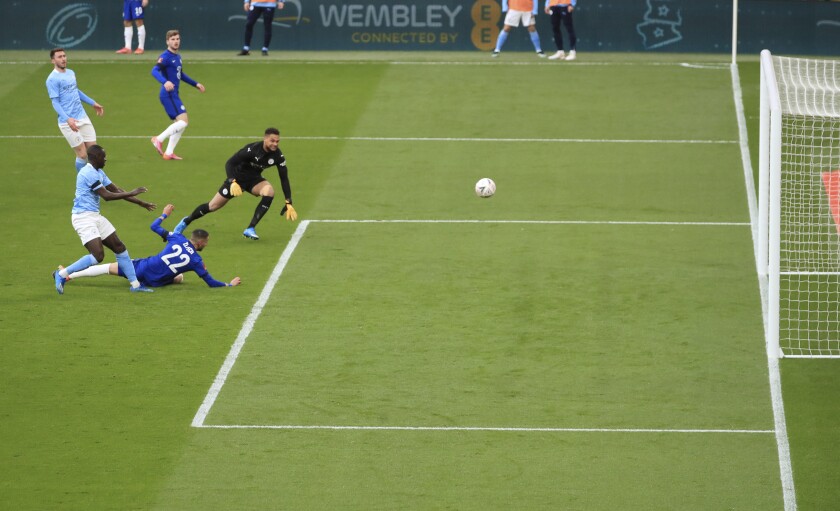 Chelsea's Hakim Ziyech scores his side's opening goal during the English FA Cup semifinal soccer match between Chelsea and Manchester City at Wembley Stadium in London, England, Saturday, April 17, 2021. (Adam Davy, Pool via AP)