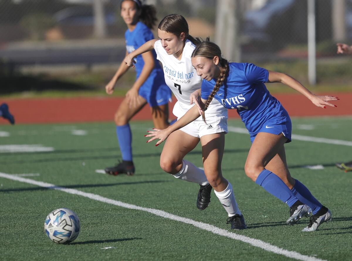 Fountain Valley's Katrina Vidal, right, gets control of the ball as Corona del Mar's Kayla Spreen defends.