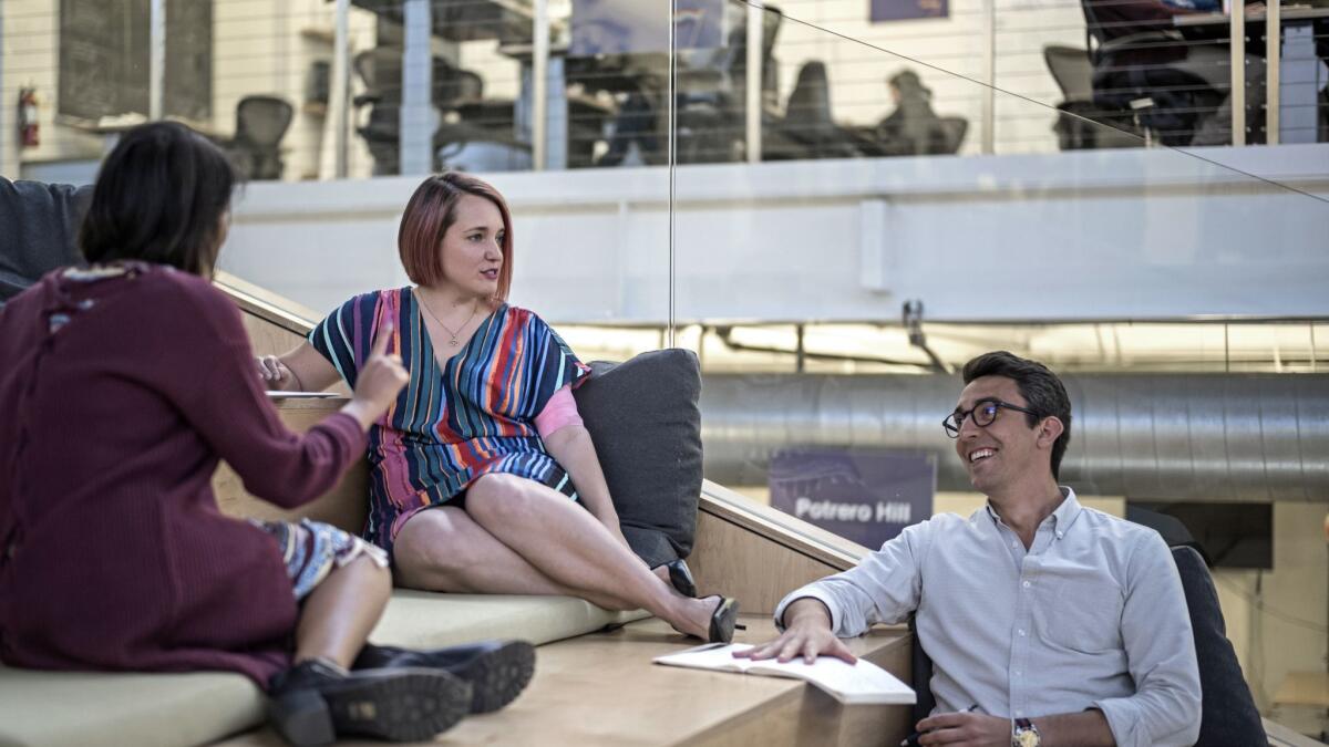 Aubrey Blanche chats with colleagues Tanaz Ahmed and Mackenzie Keegan. Atlassian's diversity and inclusion team is working to combat "diversity fatigue."