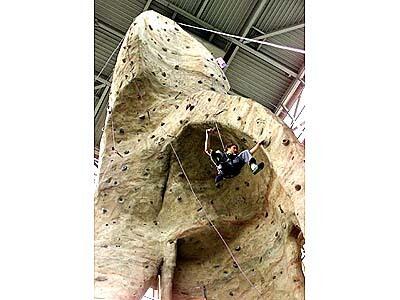 Inside the R.E.I. outdoor gear store, a 65-foot pinnacle gives rock climbers a workout sheltered from the elements.