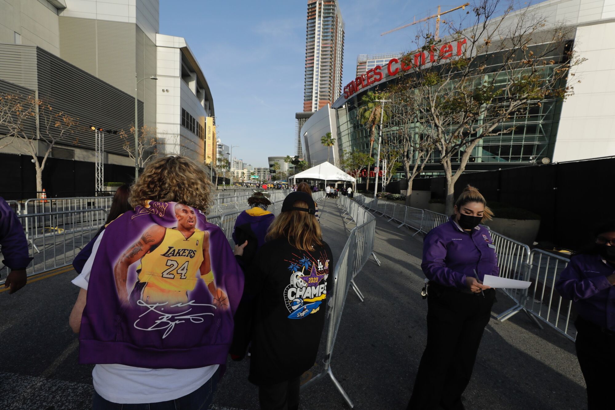 Fans line up at Staples Center to enter the arena. Attendance is limited to 2,000 for the Lakers-Celtics game on Thursday.
