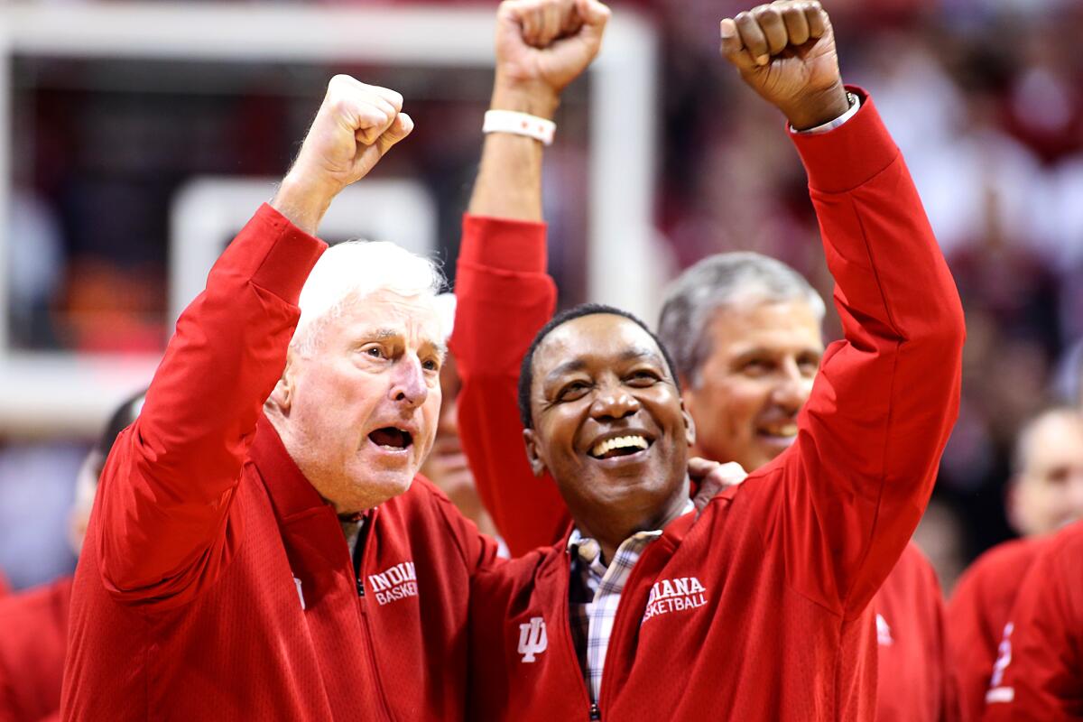 Former Indiana coach Bob Knight and Isiah Thomas acknowledge the crowd at the Hoosiers' game against Purdue on Feb. 8, 2020.