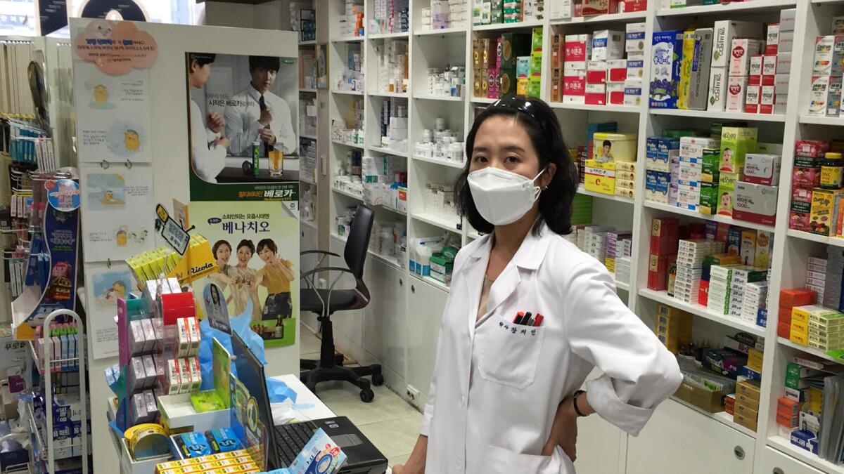 Jang Jee-in at Hana Pharmacy in central Seoul. Asked if she believes the masks can prevent MERS transmission, Jang says, “Not perfectly, but they can help.”