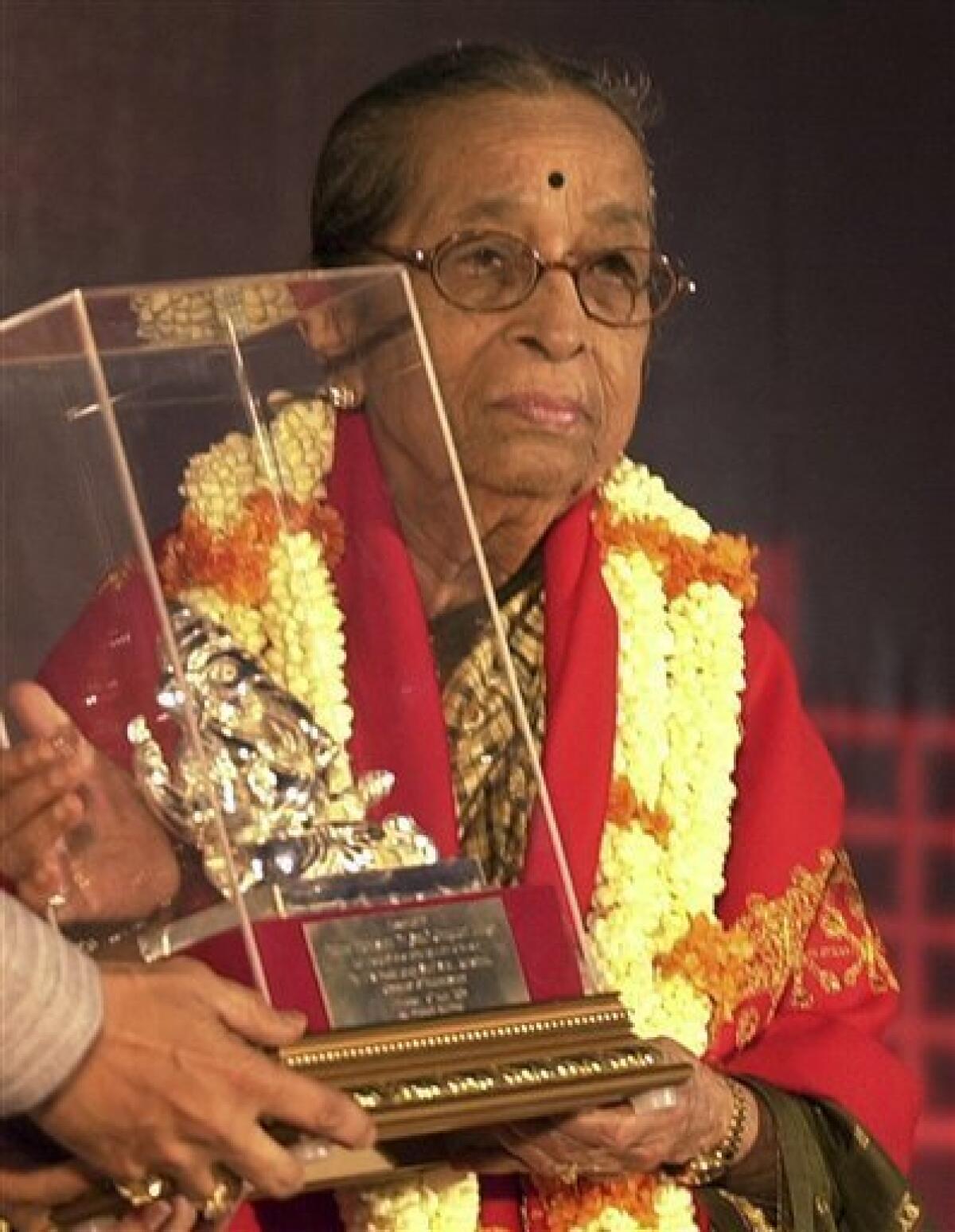 File - In this May 19, 2005 file photo, legendary Indian classical singer Gangubai Hanga is felicitated in Mumbai, India. Hangal, who battled caste and gender prejudices to establish a career that spanned more than seven decades, died Tuesday, July 21, 2009, after being briefly hospitalized for respiratory problems. She was 96. She died in Hubli, a city in Karnataka state, where she lived, PTI added. (AP Photo/Aijaz Rahi, File)