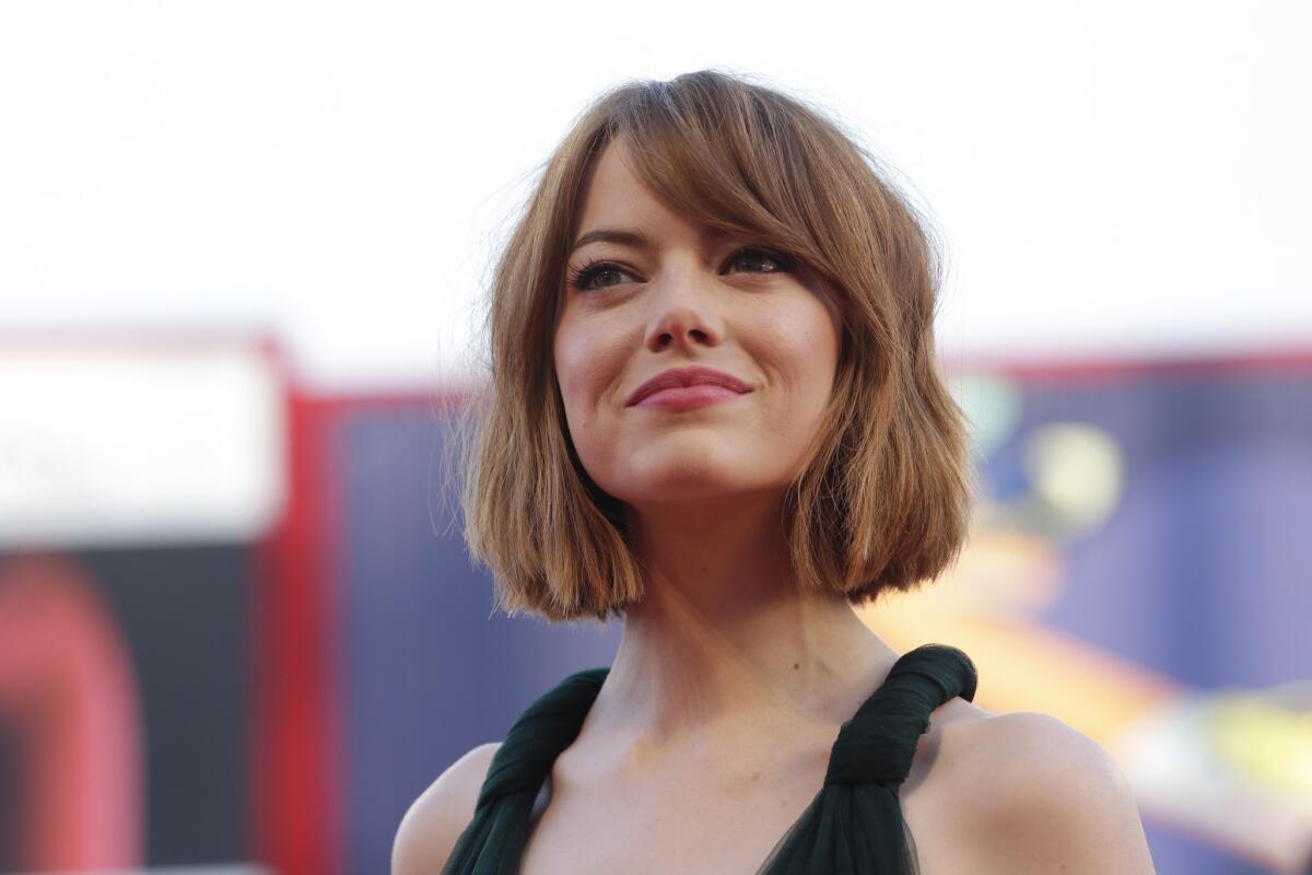 Emma Stone shows off her new haircut at the Venice Film Festival.