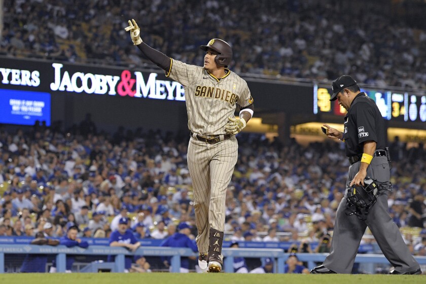 The Padres' Manny Machado gestures to the crowd after he hit a two-run home run Sept. 2, 2022.